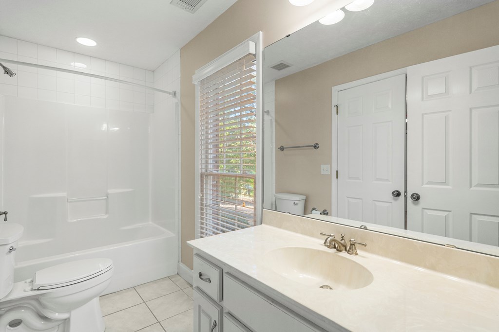 1009 Crosswinds Drive Midland, GA 31820 - Photo 18 of 29 a bathroom with a sink toilet and shower