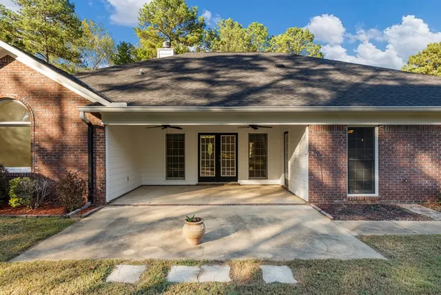 a front view of a house with a yard and a garage