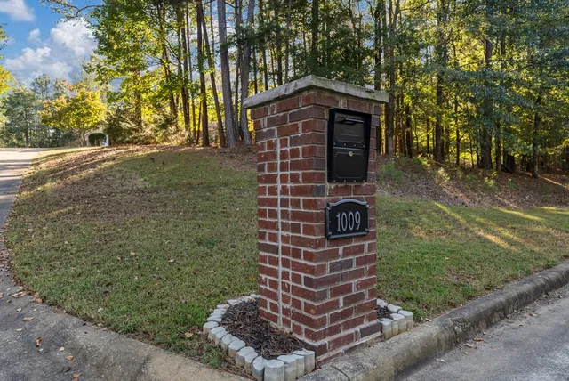 a brick building with a yard