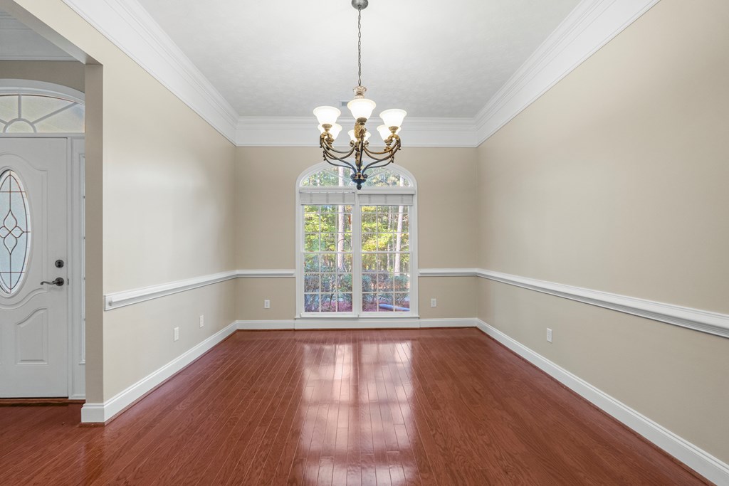 1009 Crosswinds Drive Midland, GA 31820 - Photo 5 of 29 a view of empty room with wooden floor and fan