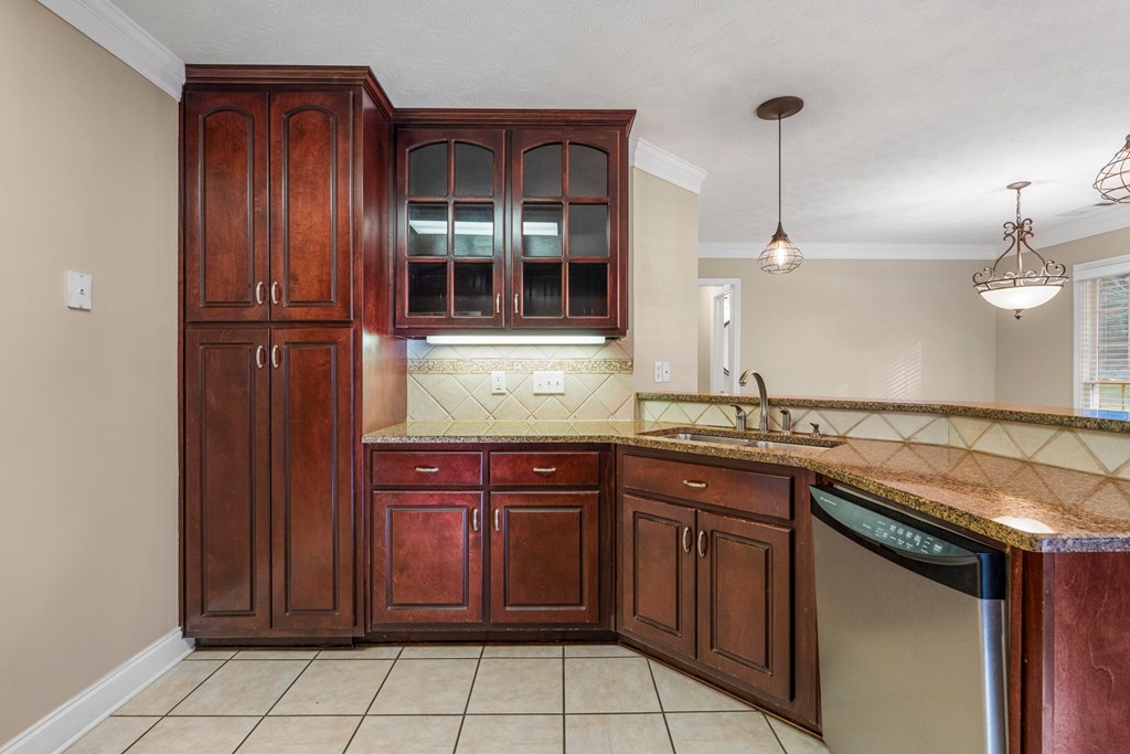 1009 Crosswinds Drive Midland, GA 31820 - Photo 7 of 29 a kitchen with a sink and cabinets