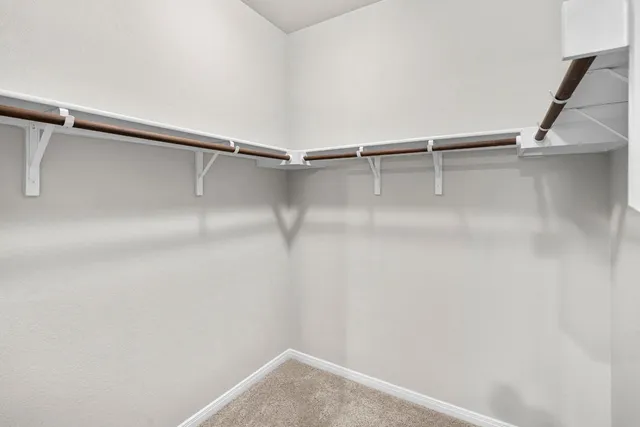 a view of an empty walk in closet