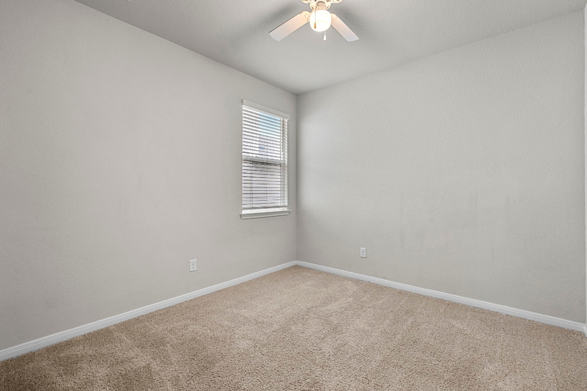 453 Apache Plum Drive Kyle, TX 78640 - Photo 25 of 30 an empty room with windows