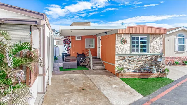 a view of house with patio outdoor seating