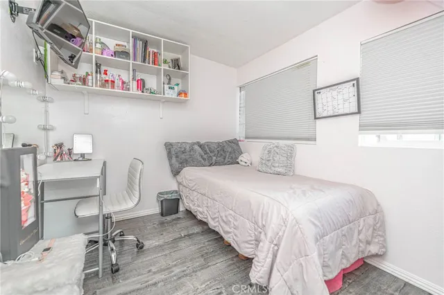 a bedroom with a bed and chair