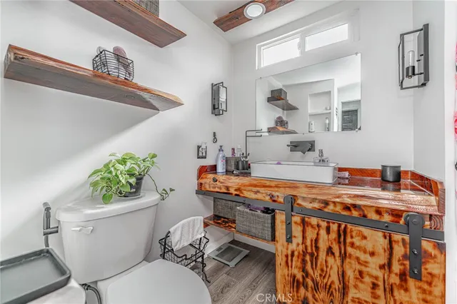 a room with furniture a chandelier and a window