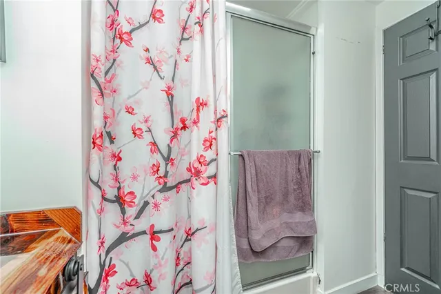 a bathroom with a shower curtain