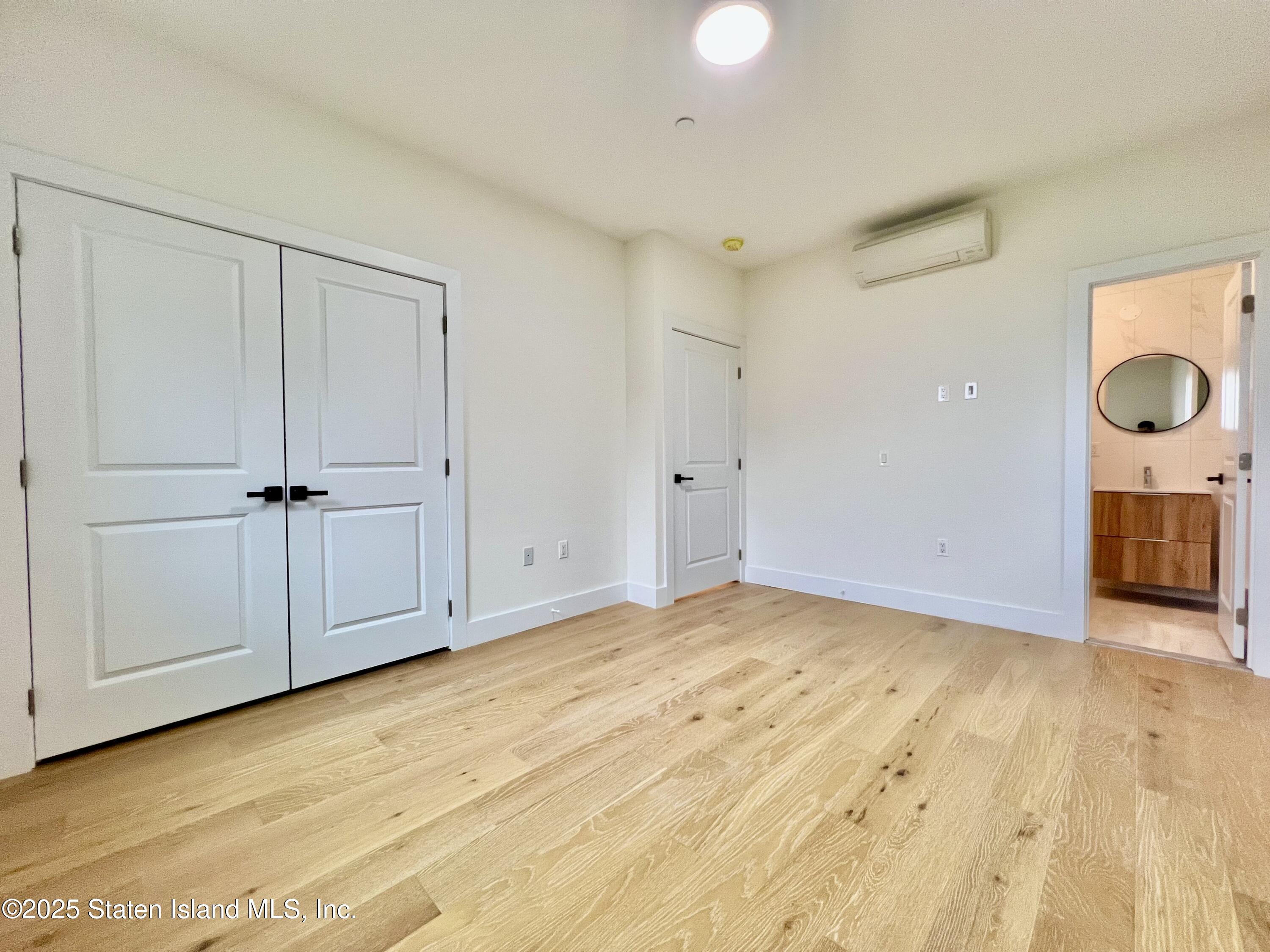 3865 Amboy Road, Unit 2G Staten Island, NY 10308 - Photo 18 of 27 a view of an empty room with wooden floor
