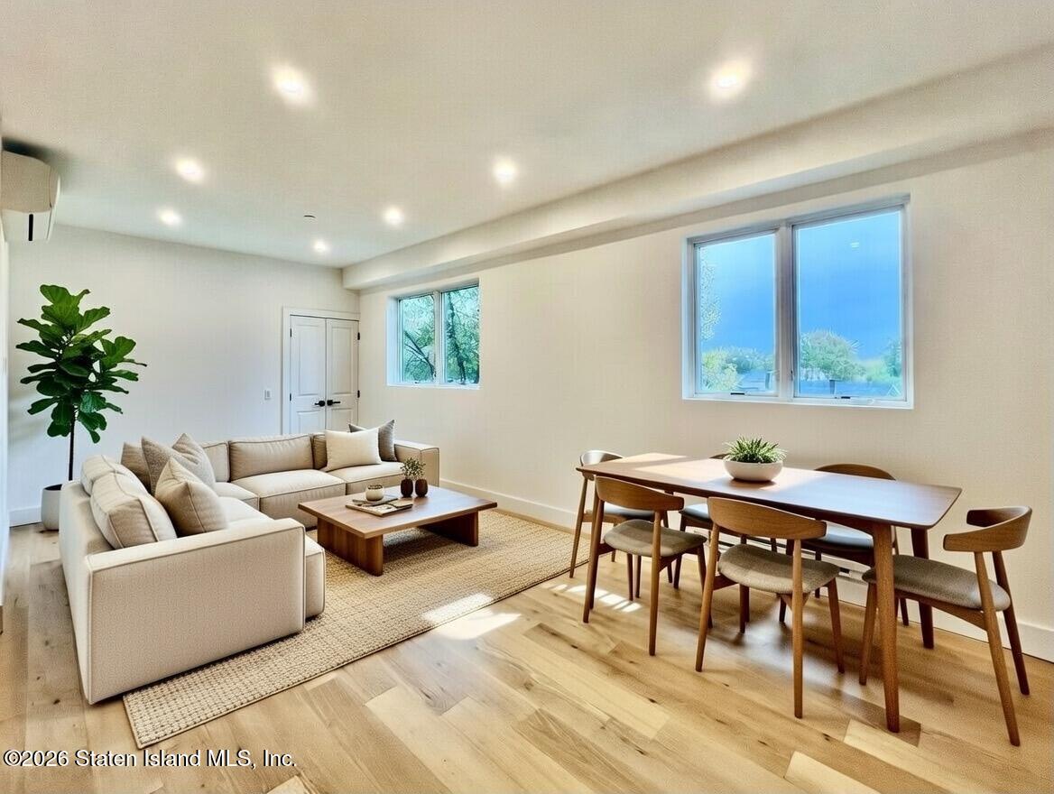 3865 Amboy Road, Unit 2G Staten Island, NY 10308 - Photo 7 of 27 a living room with furniture and a large window