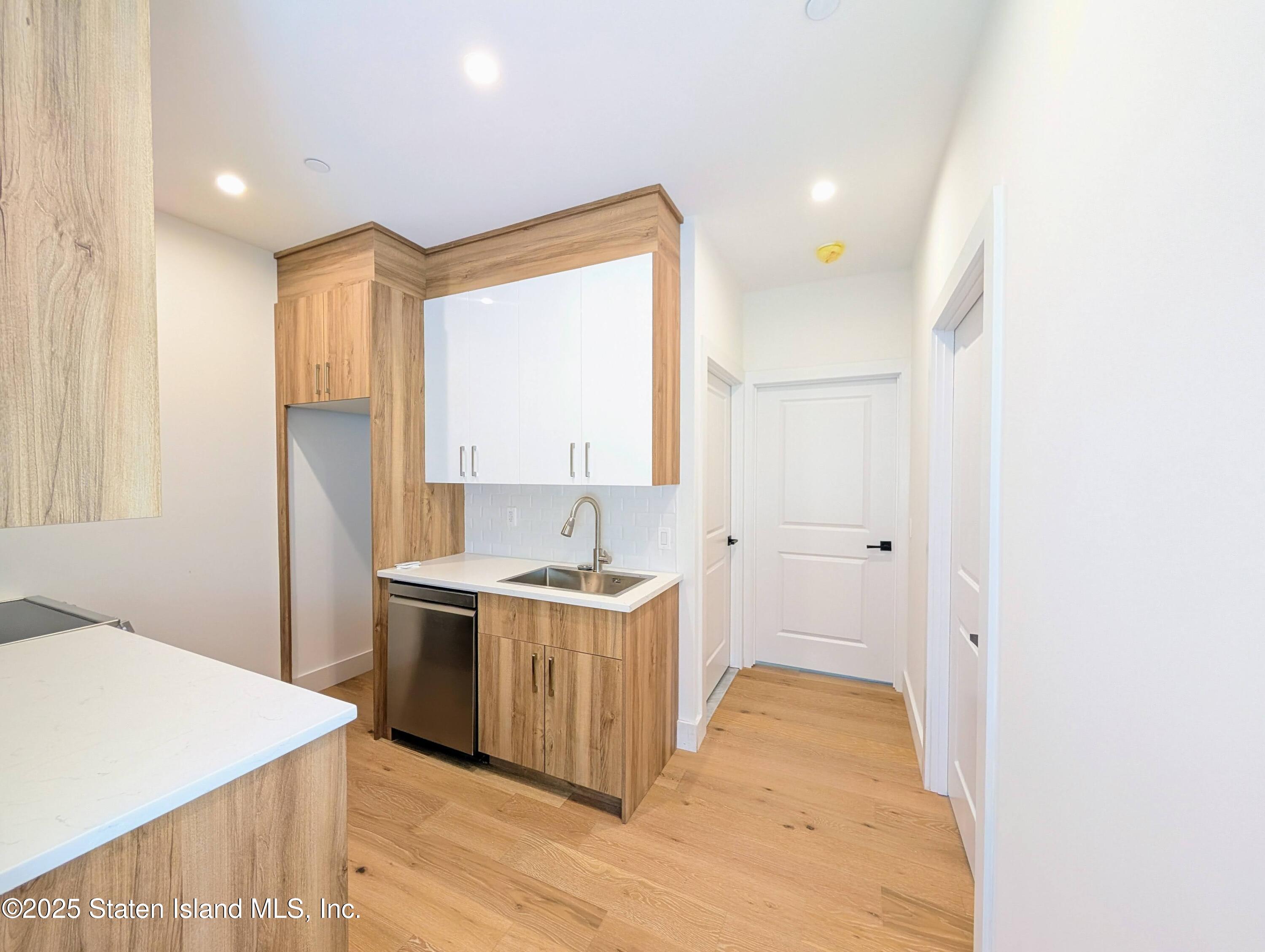 3865 Amboy Road, Unit 2G Staten Island, NY 10308 - Photo 10 of 27 a view of a kitchen with a sink cabinets and wooden floor