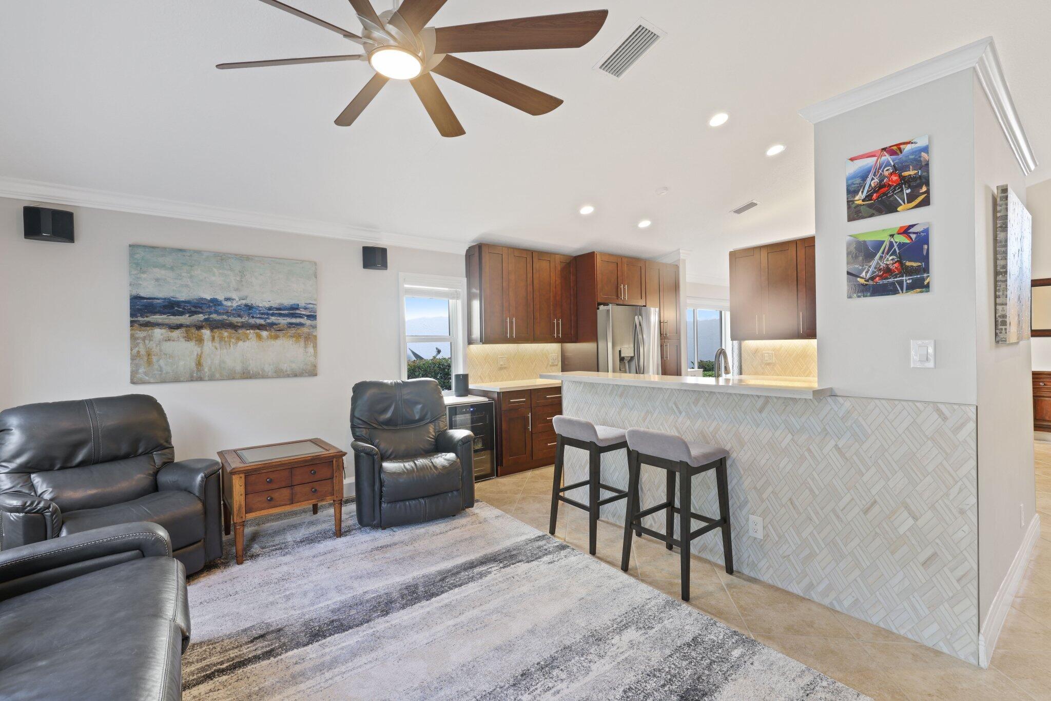 116 Cameron Drive Weston, FL 33326 - Photo 14 of 75 a living room with furniture and a flat screen tv