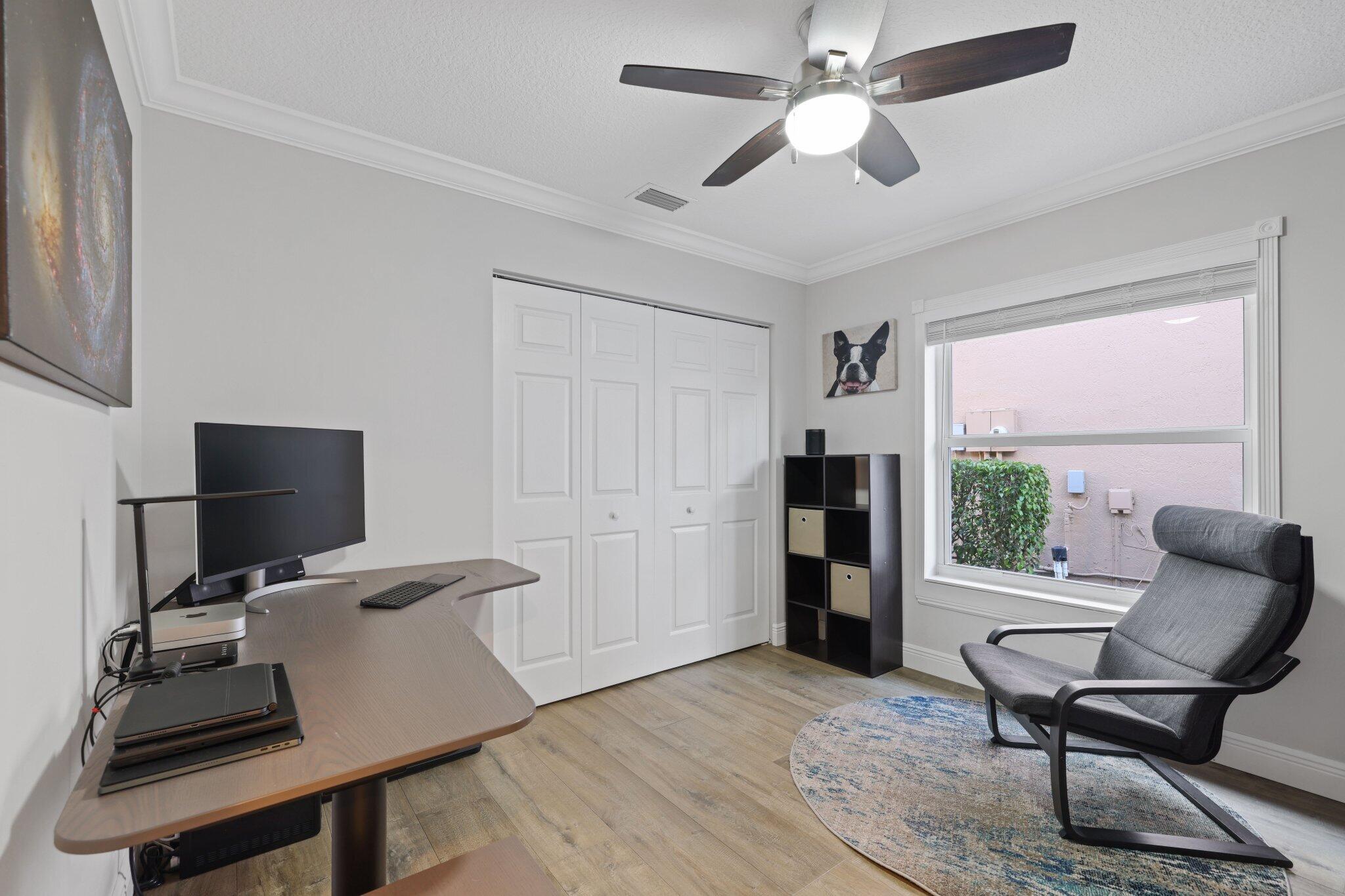 116 Cameron Drive Weston, FL 33326 - Photo 19 of 75 a view of a workspace with furniture and a window