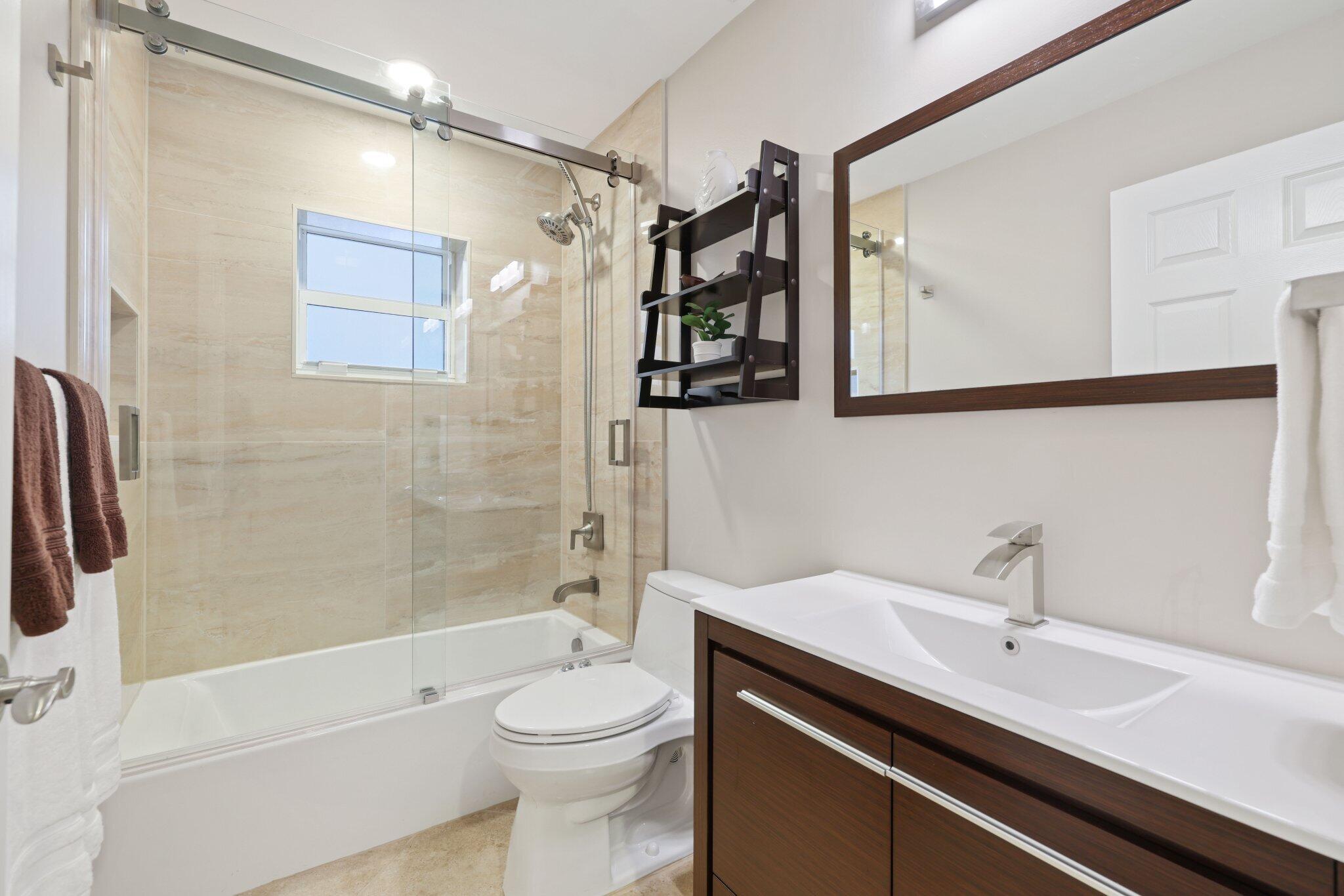 116 Cameron Drive Weston, FL 33326 - Photo 21 of 75 a bathroom with a sink a toilet and shower