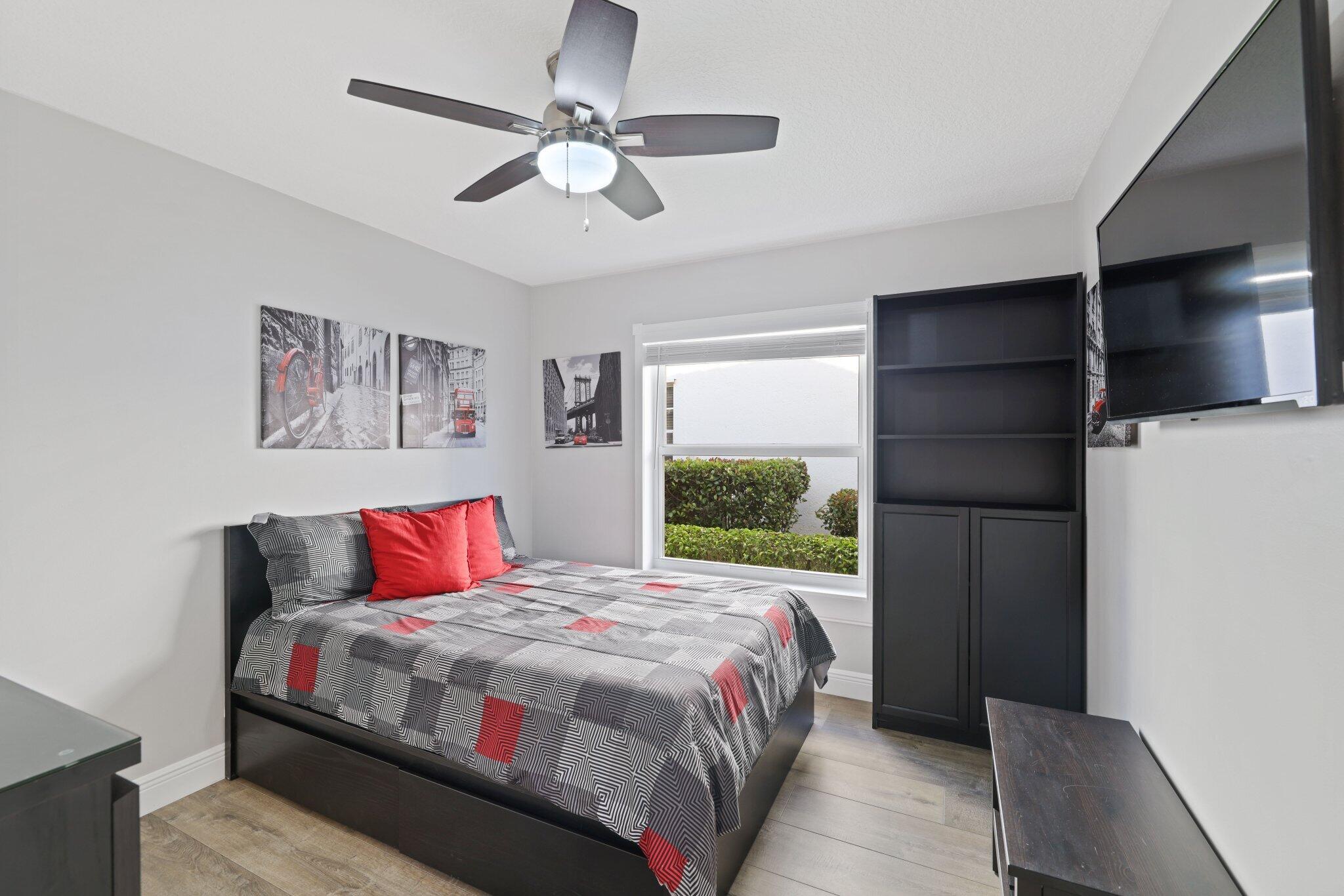 116 Cameron Drive Weston, FL 33326 - Photo 25 of 75 a bedroom with a large bed and a window