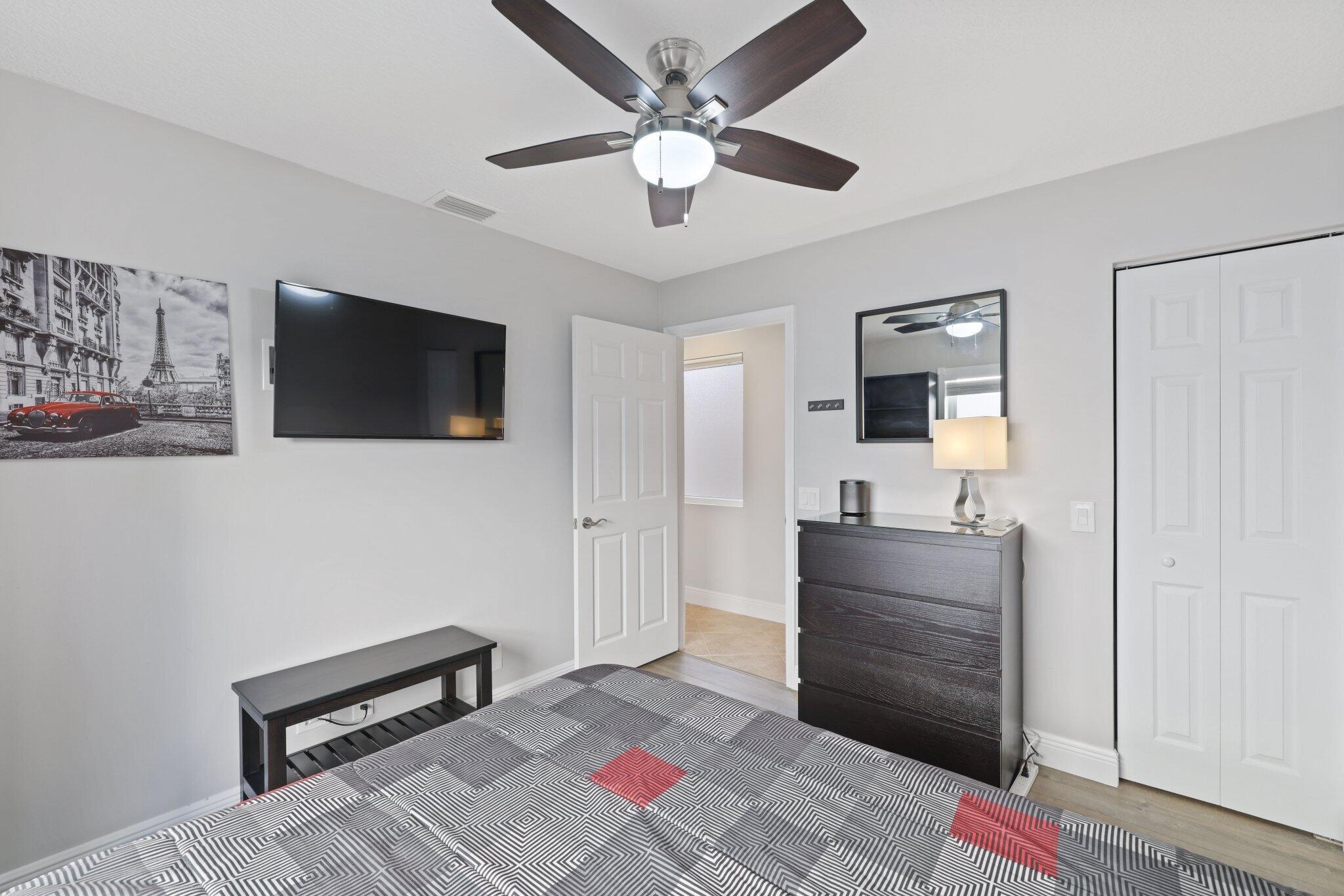 116 Cameron Drive Weston, FL 33326 - Photo 26 of 75 a living room with furniture and a flat screen tv