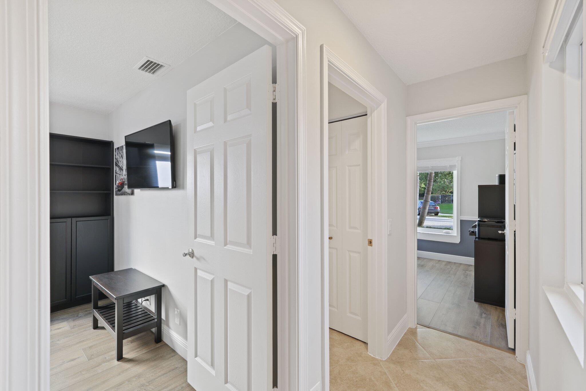116 Cameron Drive Weston, FL 33326 - Photo 27 of 75 a view of hallway with livingroom and furniture