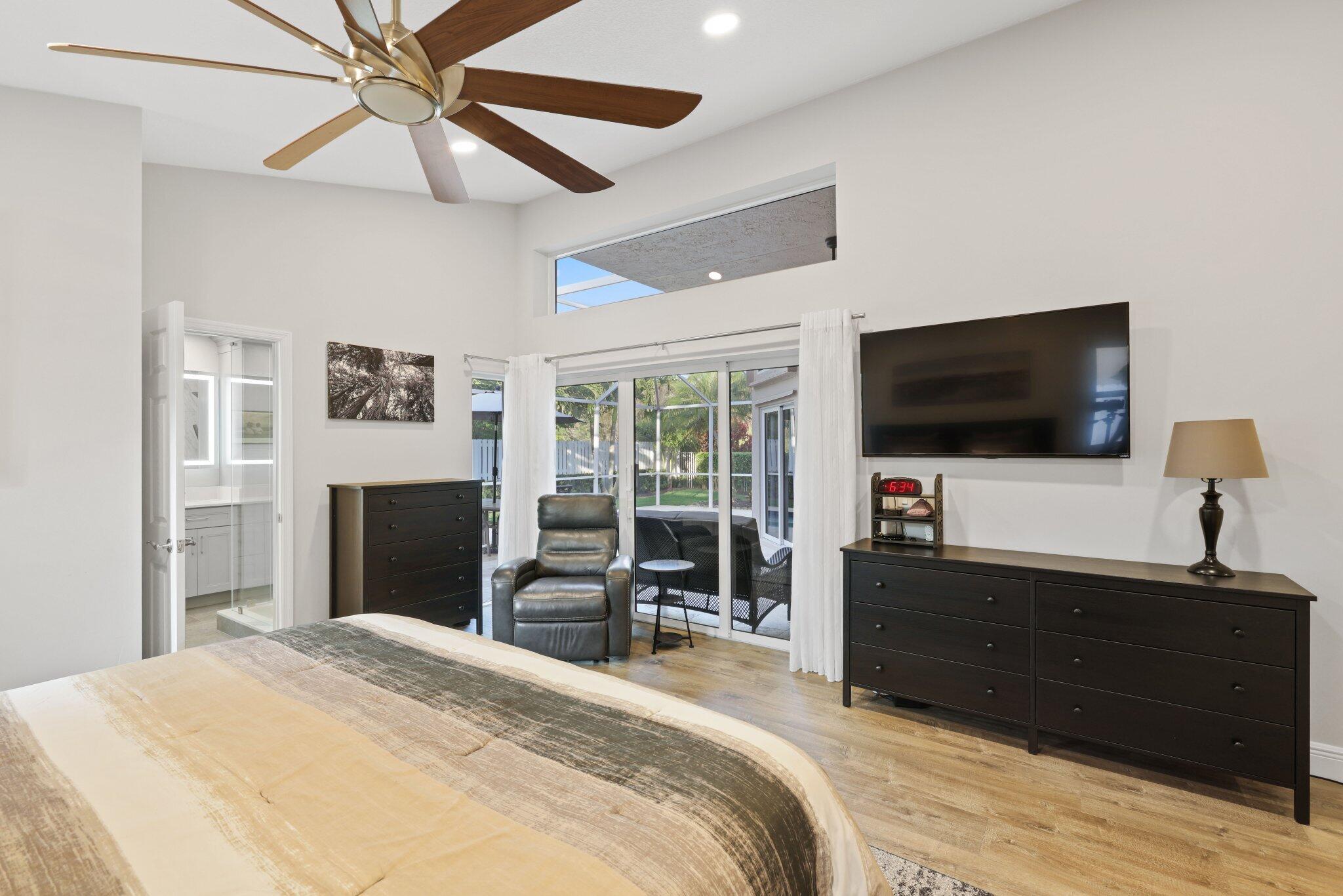 116 Cameron Drive Weston, FL 33326 - Photo 30 of 75 a bedroom with a bed and a flat screen tv