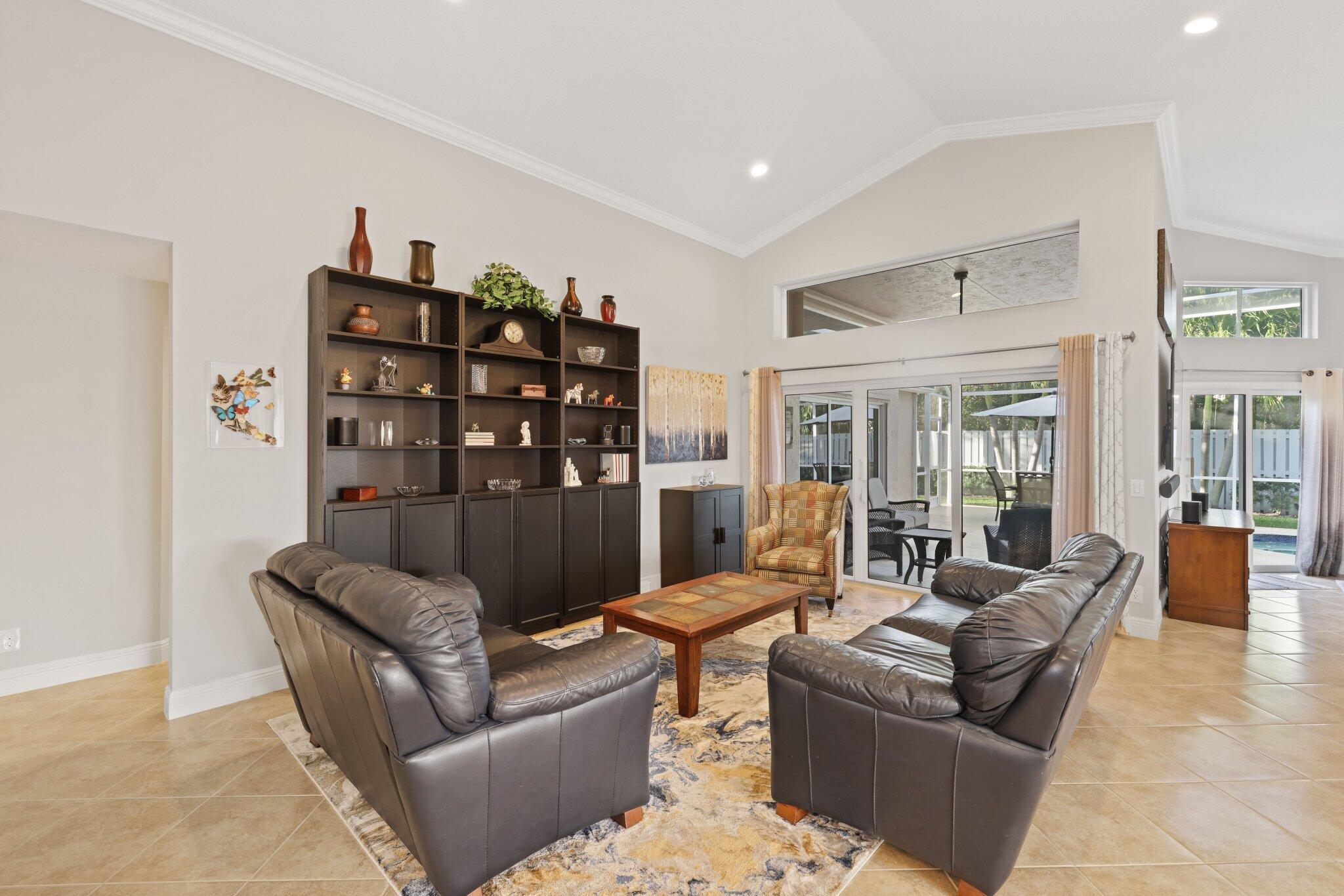 116 Cameron Drive Weston, FL 33326 - Photo 3 of 75 a living room with furniture a rug and a large window