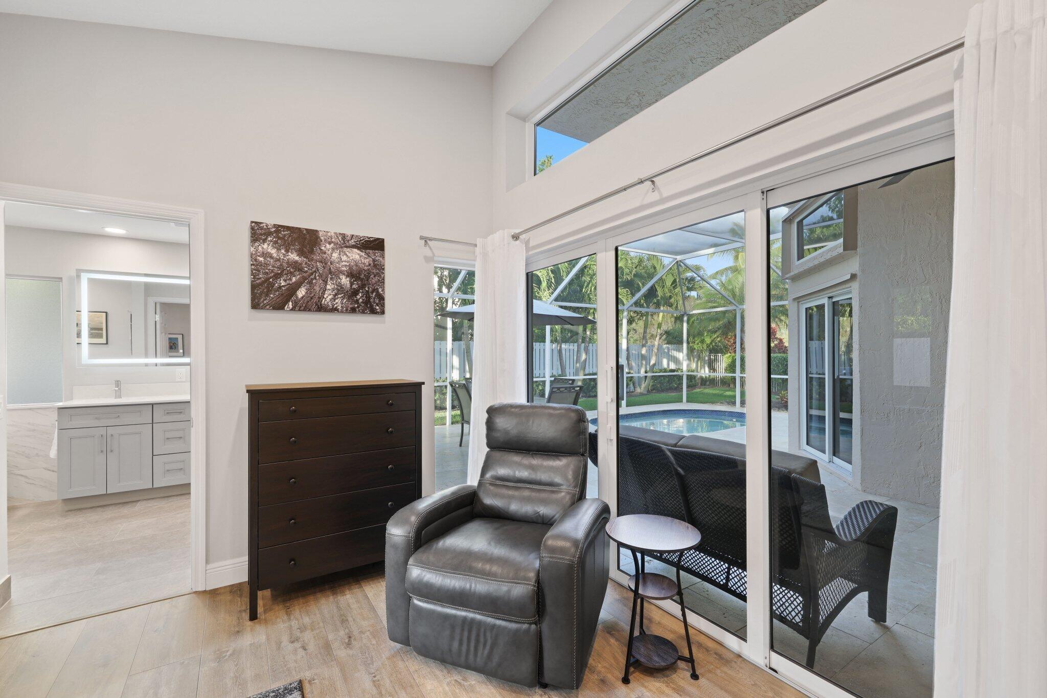 116 Cameron Drive Weston, FL 33326 - Photo 32 of 75 a living room with furniture and a fireplace