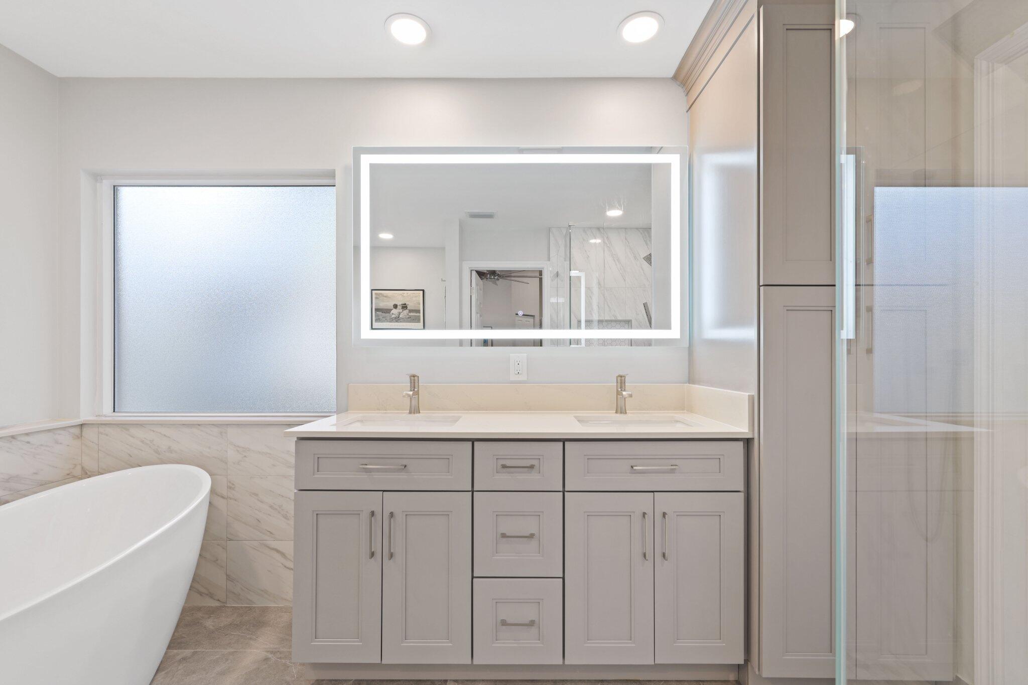 116 Cameron Drive Weston, FL 33326 - Photo 33 of 75 a bathroom with a tub a sink and mirror