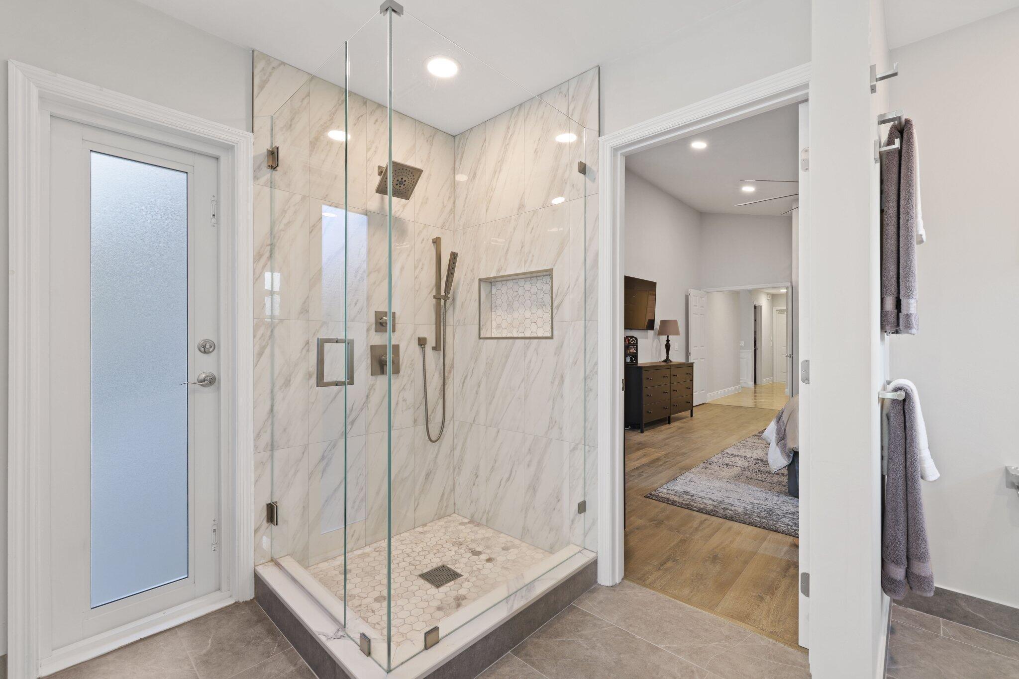 116 Cameron Drive Weston, FL 33326 - Photo 36 of 75 a bathroom with a glass shower door