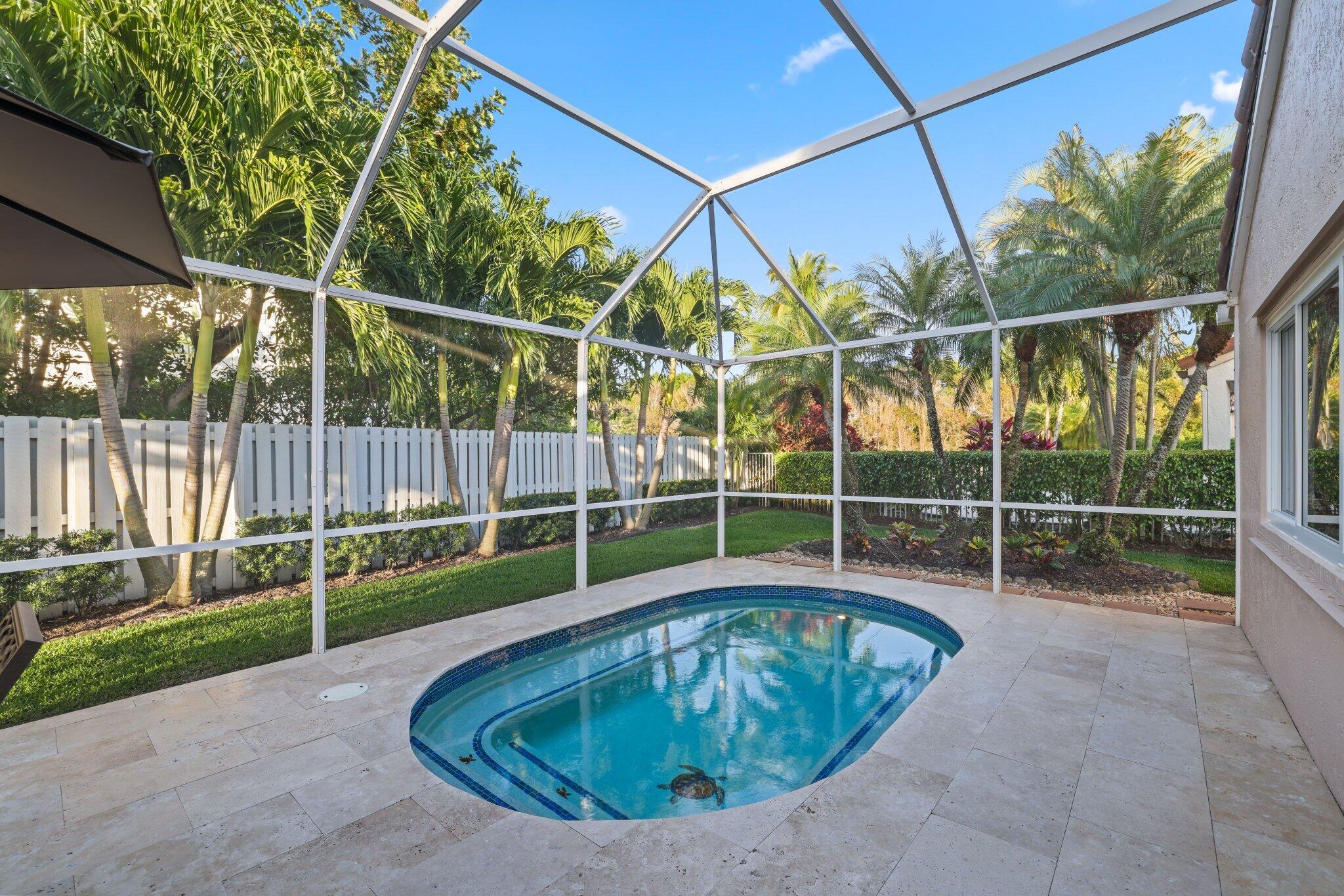 116 Cameron Drive Weston, FL 33326 - Photo 39 of 75 a view of a swimming pool with a small yard and wooden fence