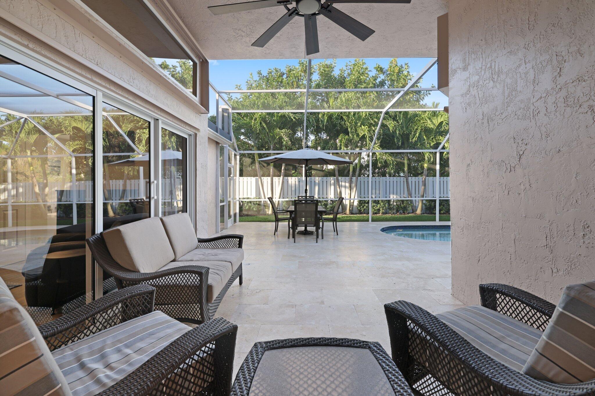 116 Cameron Drive Weston, FL 33326 - Photo 42 of 75 a view of a workspace with furniture and a large window