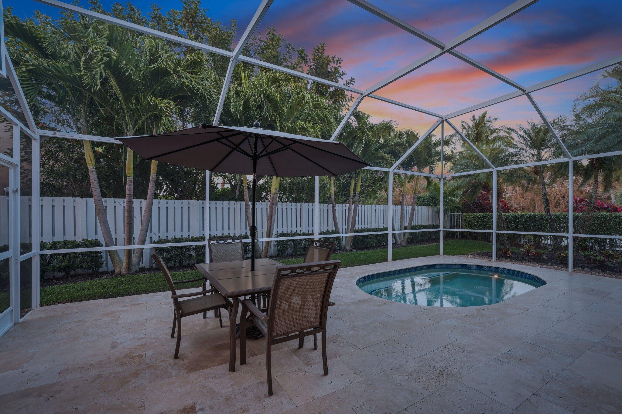 116 Cameron Drive Weston, FL 33326 - Photo 45 of 75 a backyard of a house with table and chairs