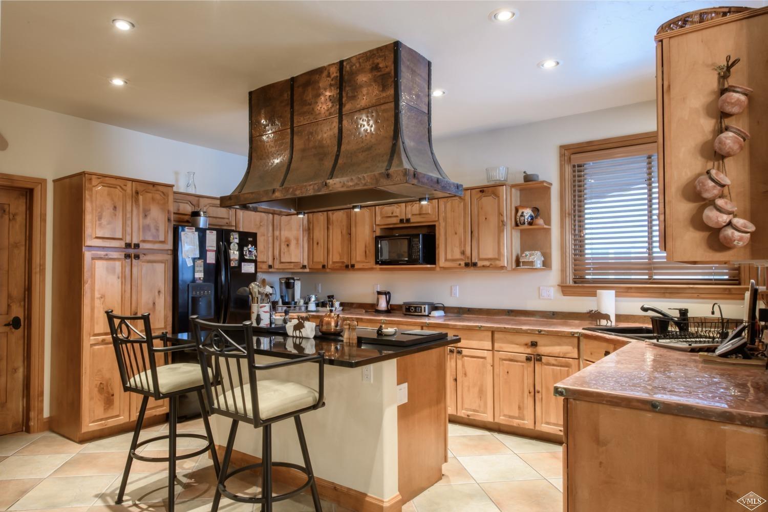160 Timberwolf Gypsum, CO 81637 - Photo 7 of 9 Kitchen with copper counters & hood