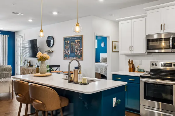 a kitchen with a sink cabinets and stainless steel appliances