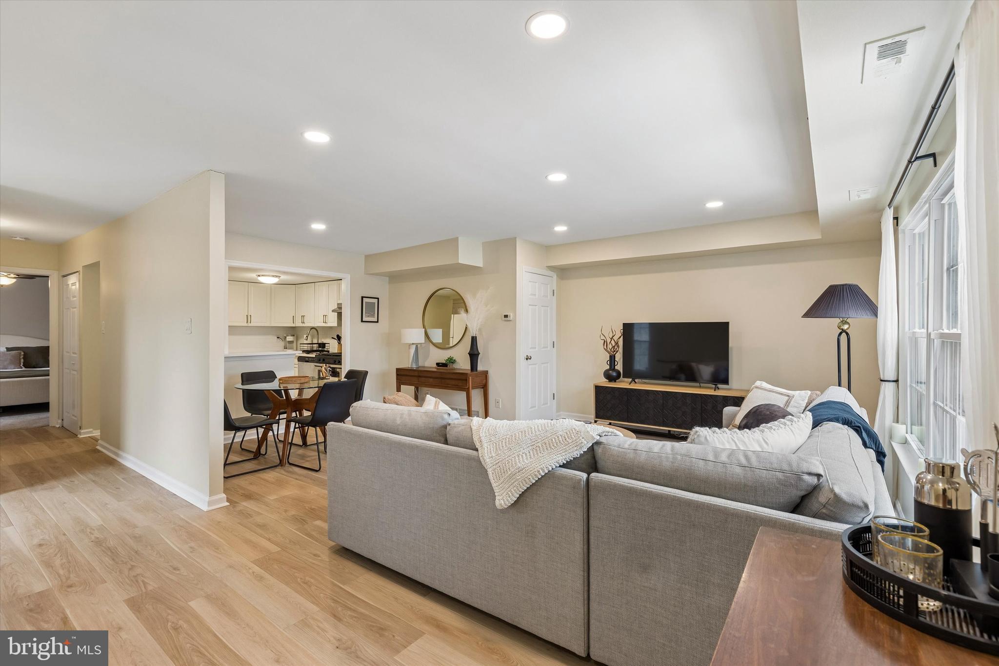 437 Old Forge Crossing, Unit 437 Devon, PA 19333 - Photo 1 of 22 a living room with furniture and a flat screen tv