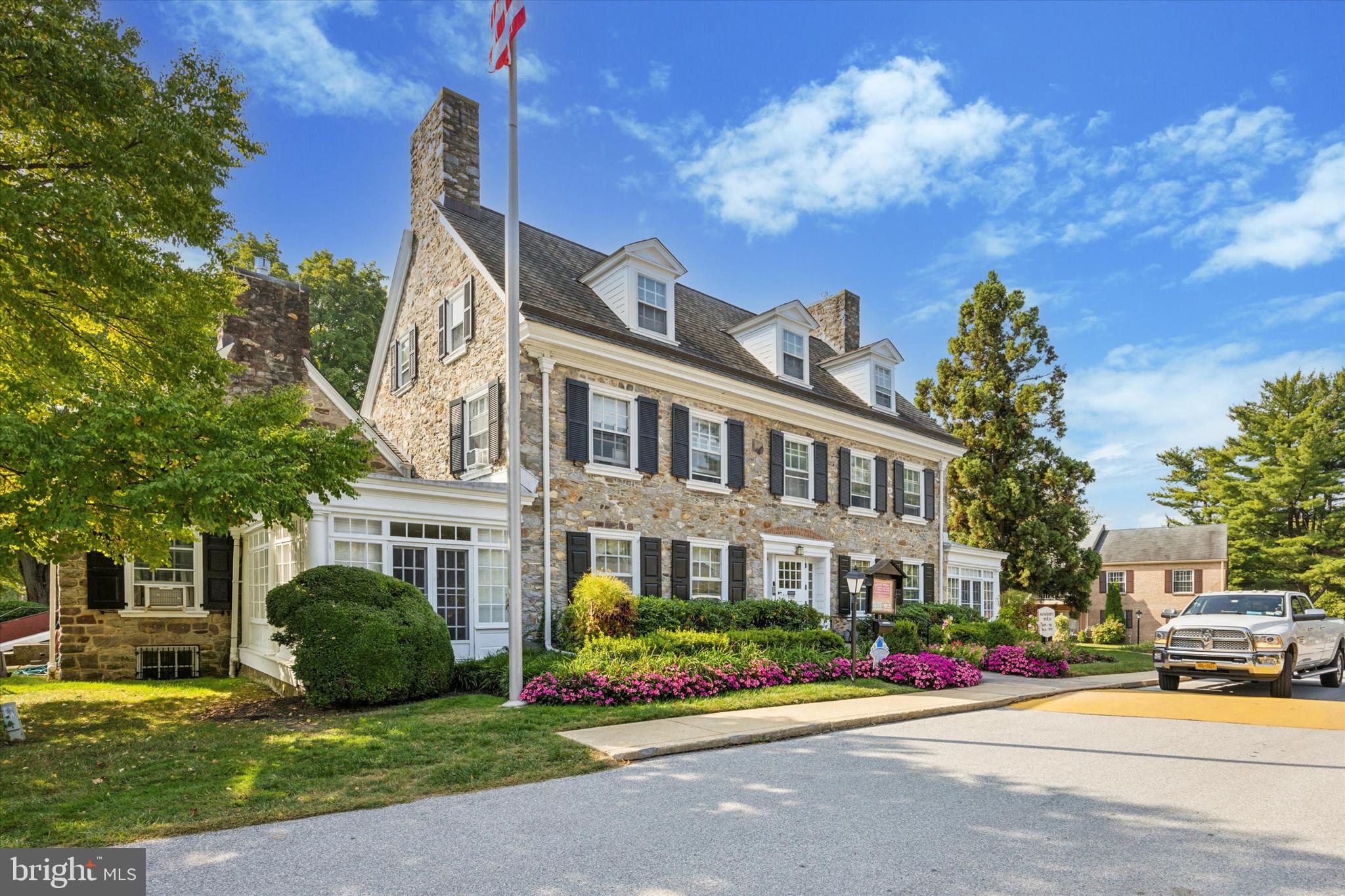 437 Old Forge Crossing, Unit 437 Devon, PA 19333 - Photo 21 of 22 a front view of a building with garden