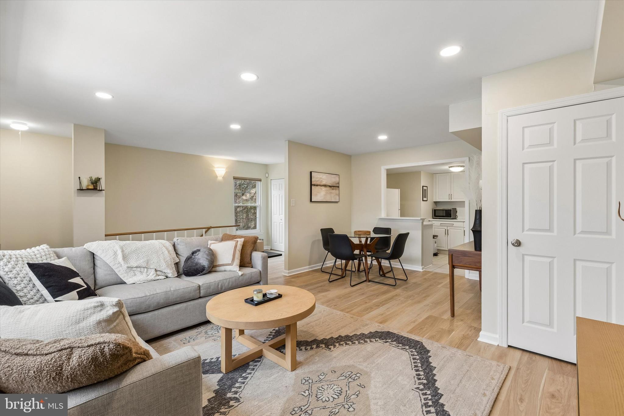 437 Old Forge Crossing, Unit 437 Devon, PA 19333 - Photo 6 of 22 a living room with furniture and wooden floor