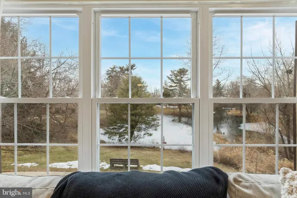 a living room with a large window and table
