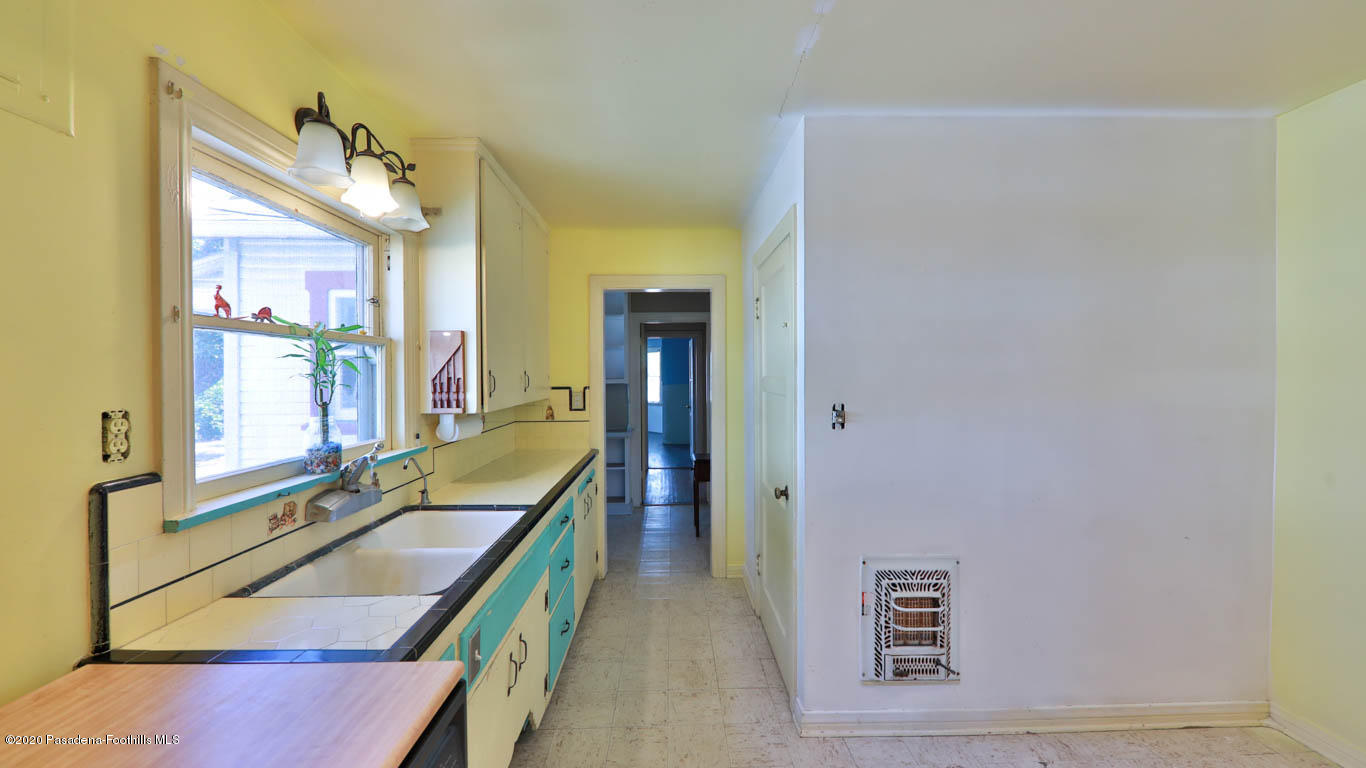 11364 Lambert Avenue El Monte, CA 91732 - Photo 12 of 39 a bathroom with a sink a mirror and a bathtub