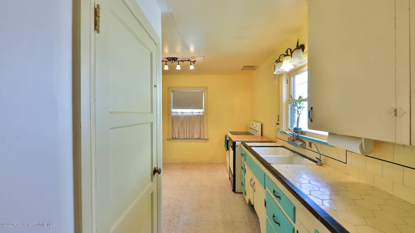 11364 Lambert Avenue El Monte, CA 91732 - Photo 13 of 39 a bathroom with a granite countertop sink and a mirror