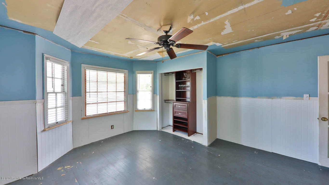 11364 Lambert Avenue El Monte, CA 91732 - Photo 19 of 39 an empty room with chandelier fan and windows