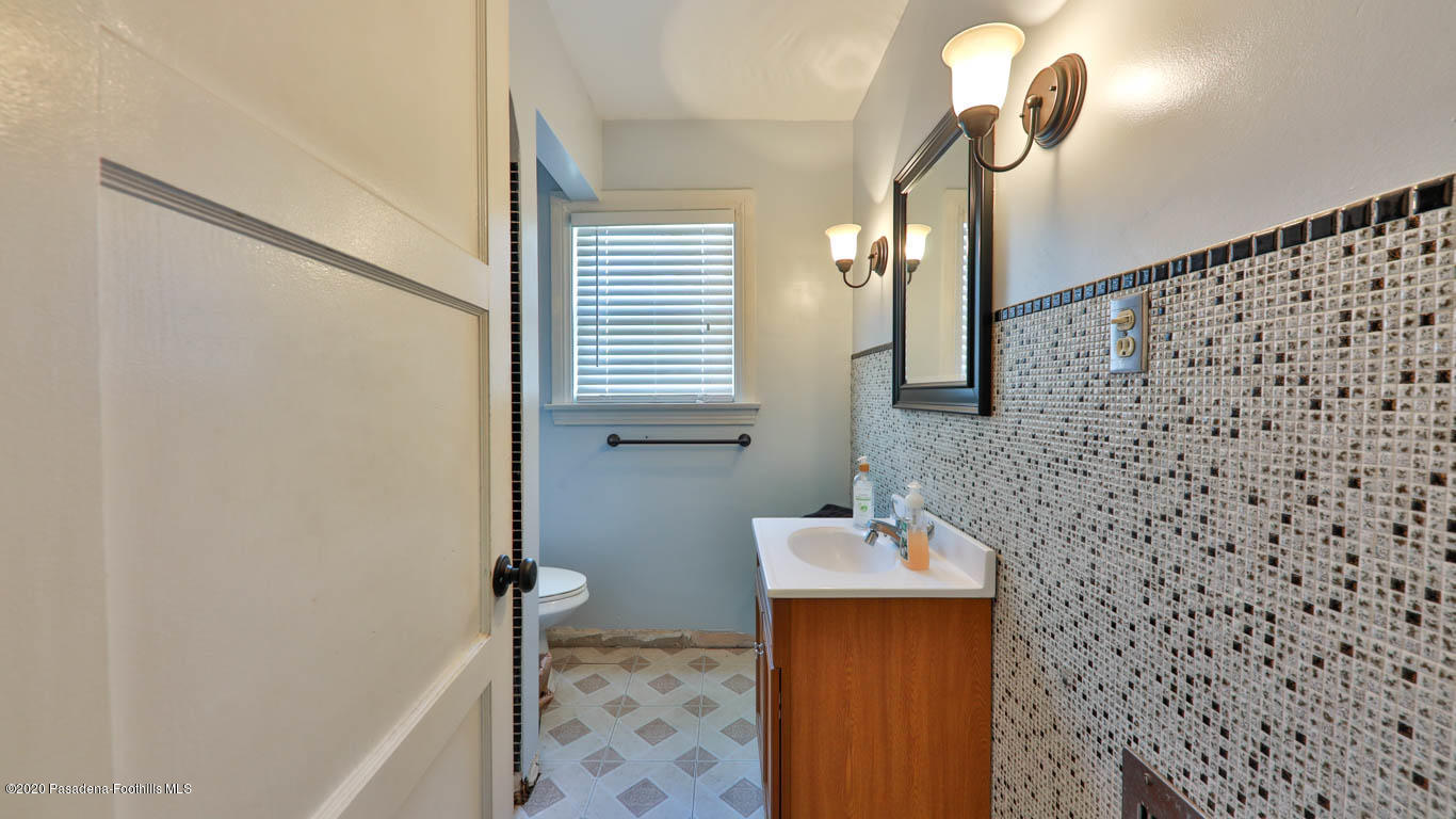 11364 Lambert Avenue El Monte, CA 91732 - Photo 22 of 39 a bathroom with a sink a mirror and a shower