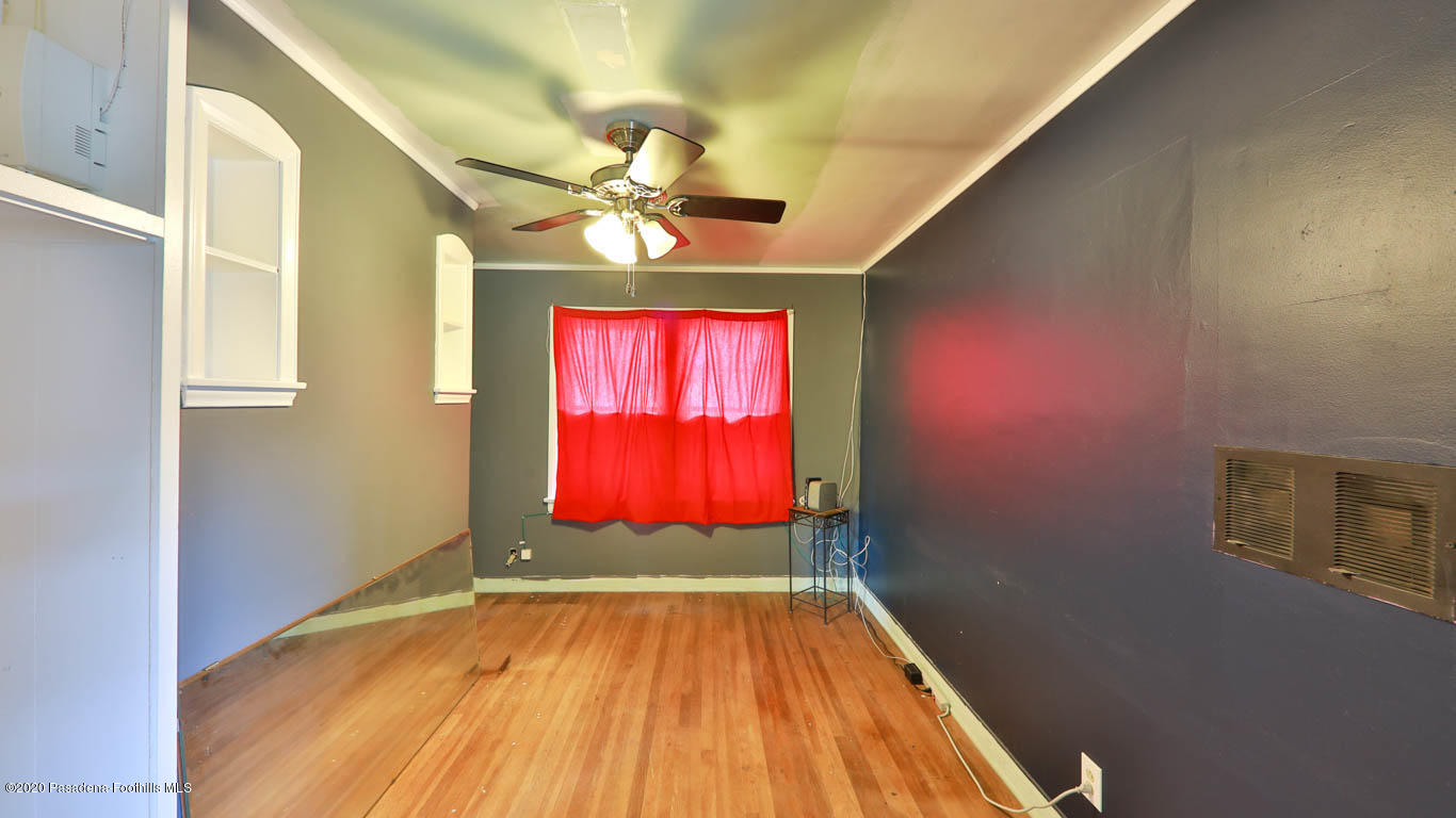 11364 Lambert Avenue El Monte, CA 91732 - Photo 27 of 39 a view of a room with window a ceiling fan and wooden floor