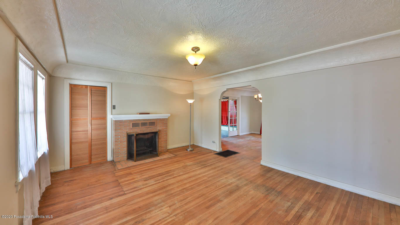 11364 Lambert Avenue El Monte, CA 91732 - Photo 4 of 39 wooden floor in an empty room with a fireplace