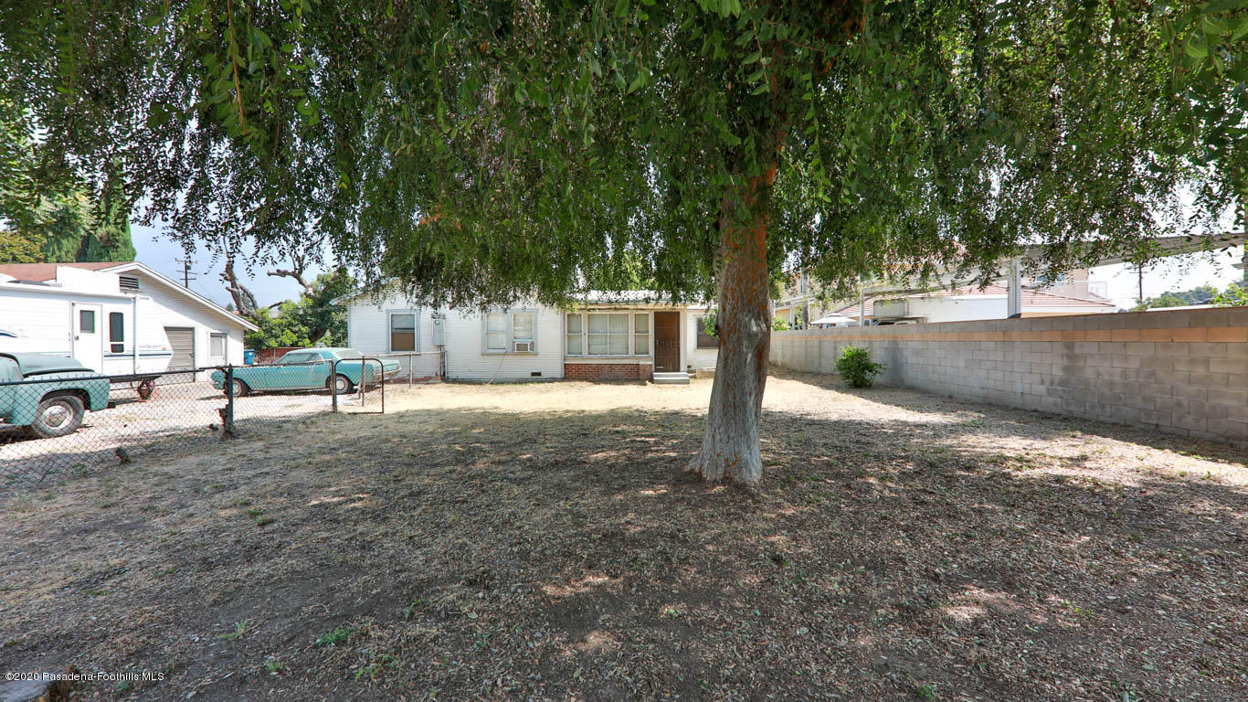 11364 Lambert Avenue El Monte, CA 91732 - Photo 34 of 39 a white house that has a tree in front of it