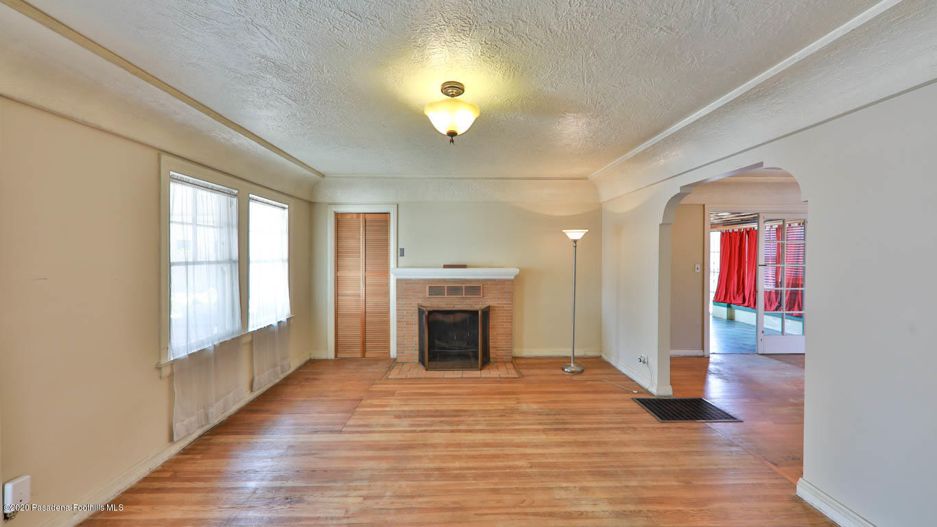 11364 Lambert Avenue El Monte, CA 91732 - Photo 5 of 39 a view of an empty room with window and fire place