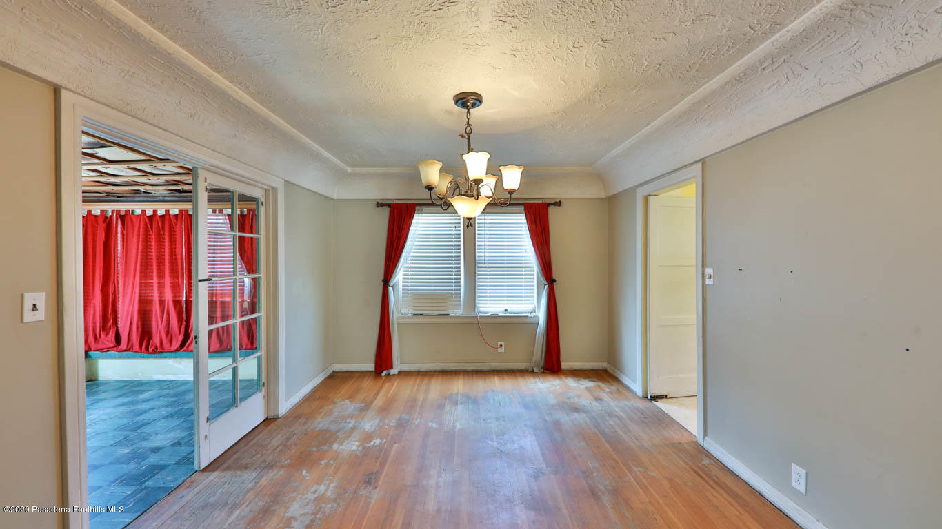 11364 Lambert Avenue El Monte, CA 91732 - Photo 8 of 39 a view of a room with wooden floor chandeliers and kitchen view