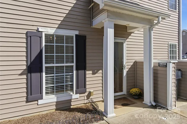 a view of house with a window and brick wall