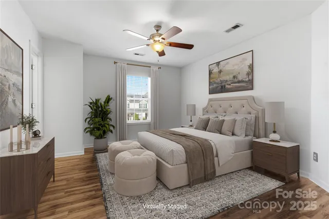 a bed room with a bed and a chandelier