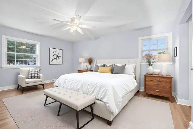 a bedroom with a bed and a couch