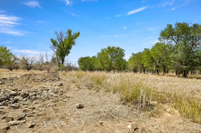a view of snow on the side of a road