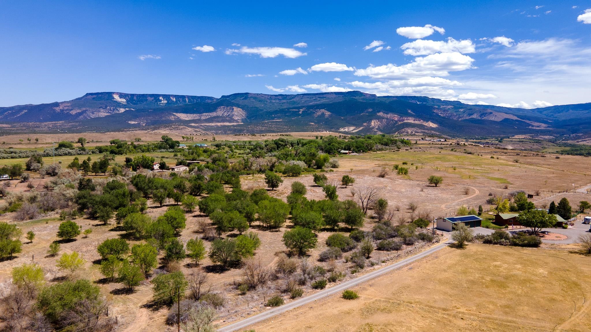 3003 Purdy Mesa Road Whitewater, CO 81527 - Photo 3 of 33 a view of a city with mountains in the background