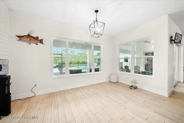 a bedroom with a large bed and a tv