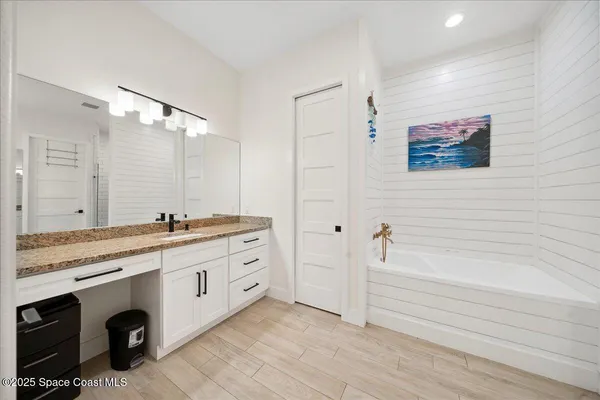 a bedroom with two beds and a window